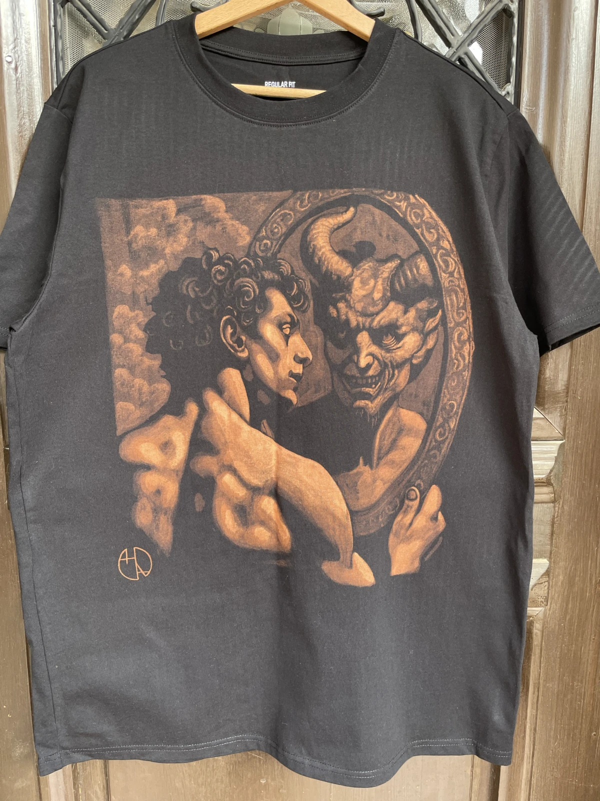 Angel and demon reflection bleach art design on black T-shirt