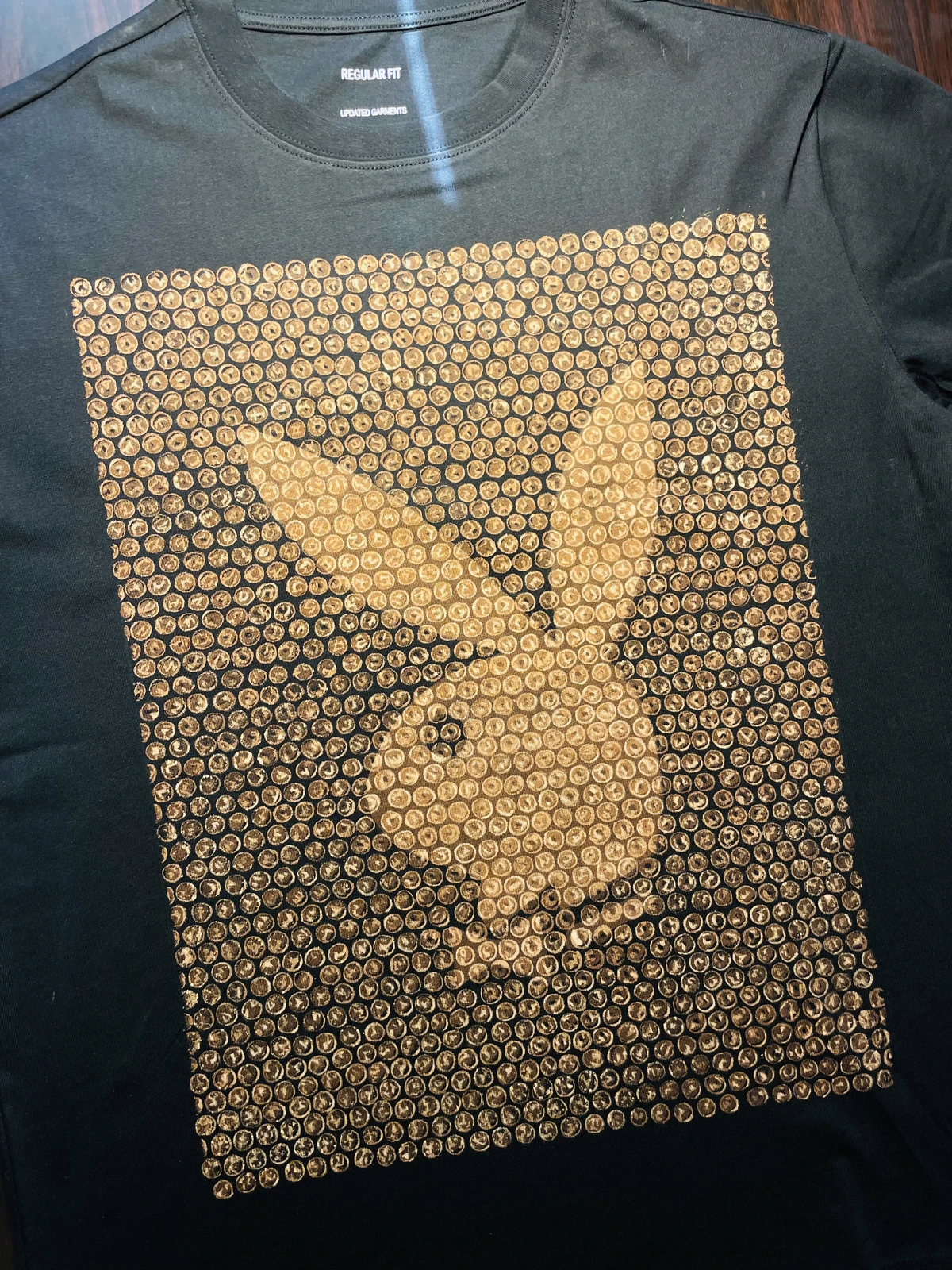 Minimal Playboy bunny bleach shirt design with textured bubble effect on black cotton