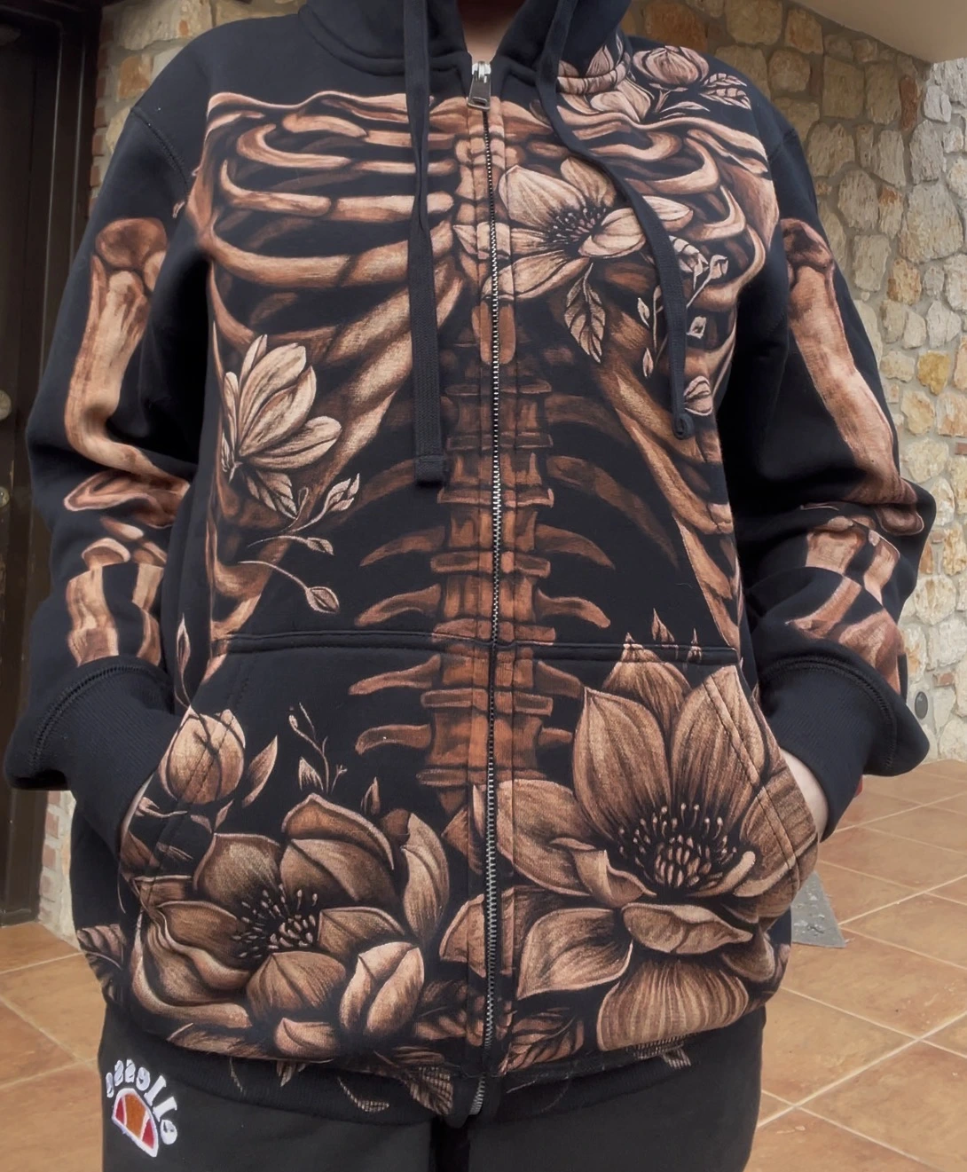 Skeleton and magnolia flowers bleach art design on black zip hoodie