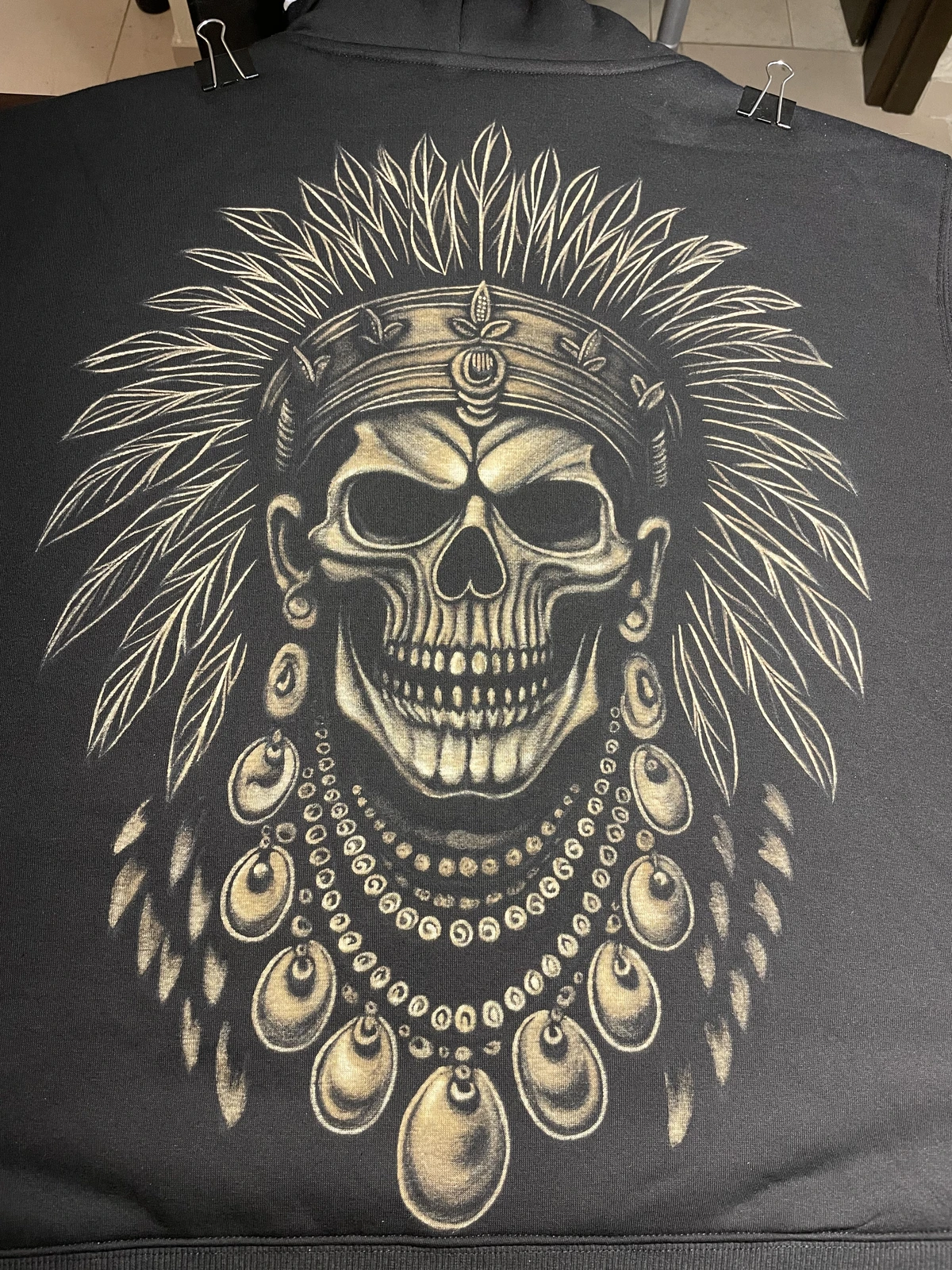 Tribal skull bleach art design on black hoodie