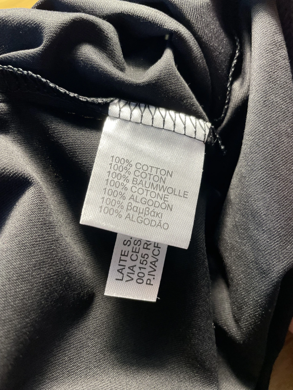 Clothing label showing 100 percent cotton fabric used for bleach art testing