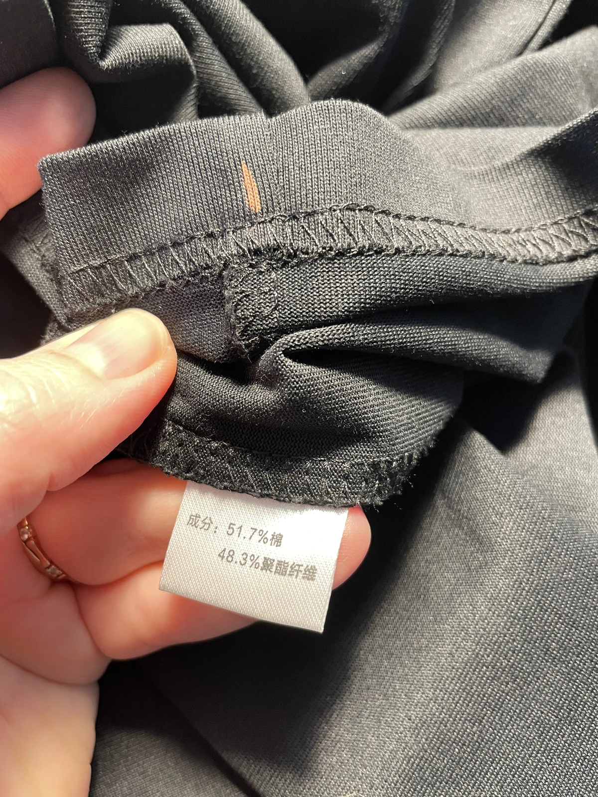 Clothing label showing cotton polyester blend fabric used for bleach art testing