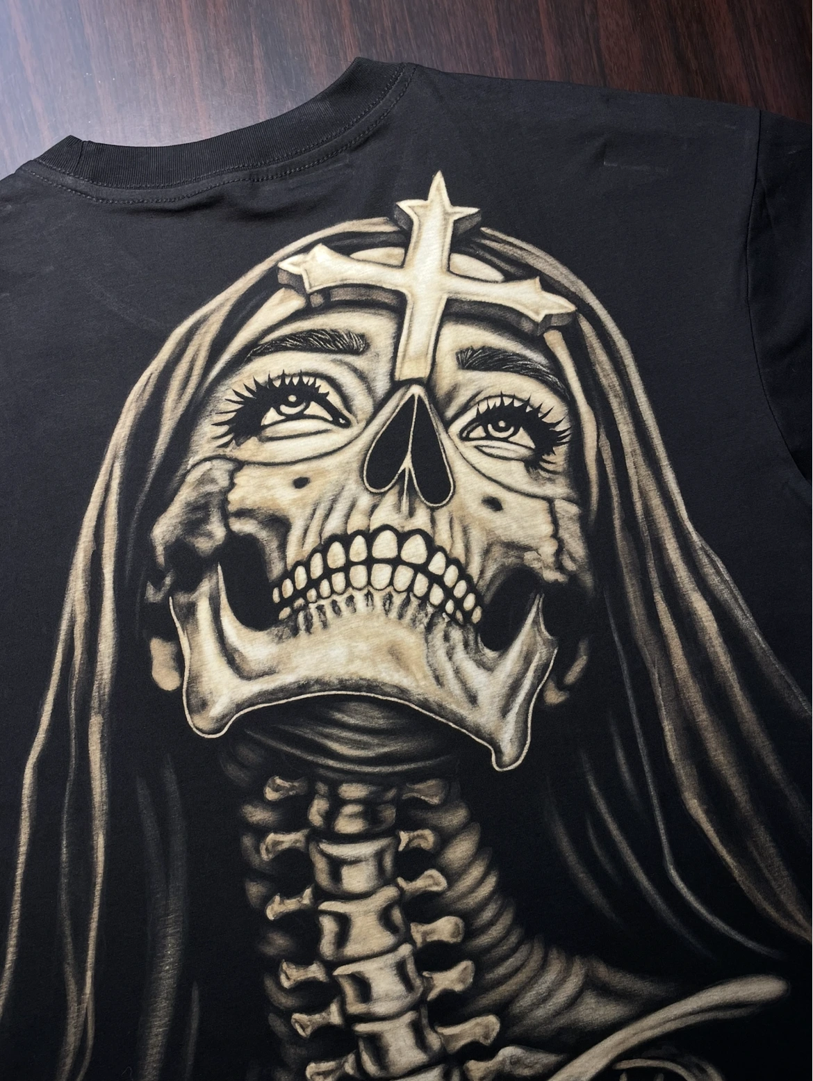 Finished bleach art design on black 100 percent cotton fabric with white and grey bleach reaction