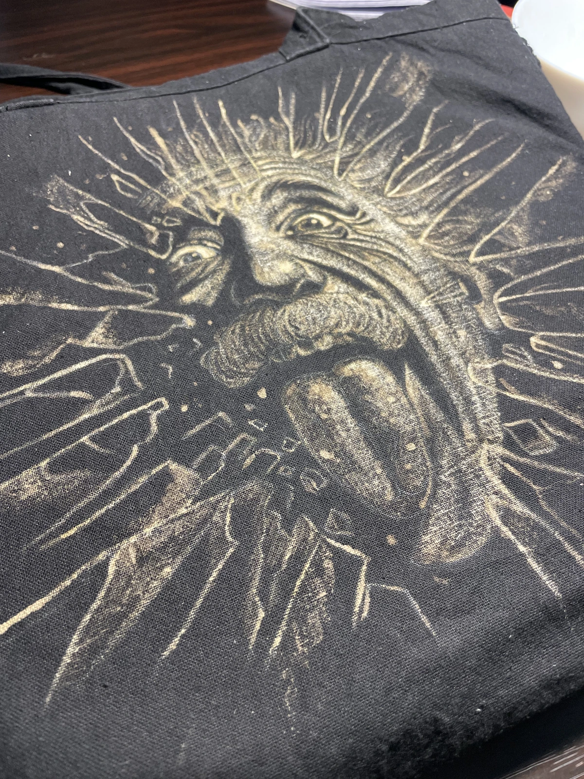 Finished bleach art design on dense black cotton tote bag