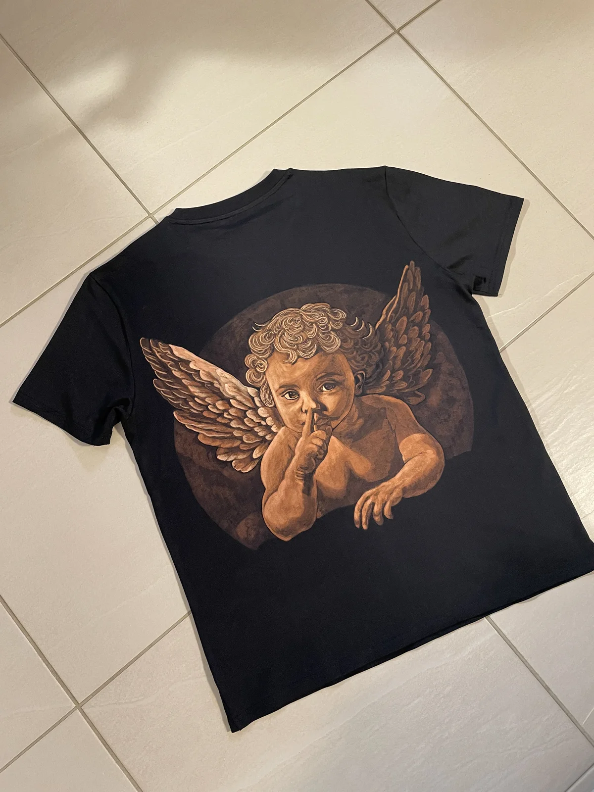 Hand painted bleach art angel character on black shirt