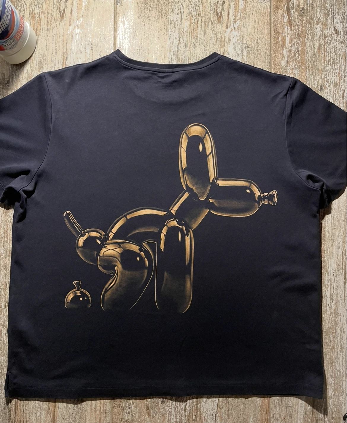 Back view of the same two-sided bleach art T-shirt with a large central artwork