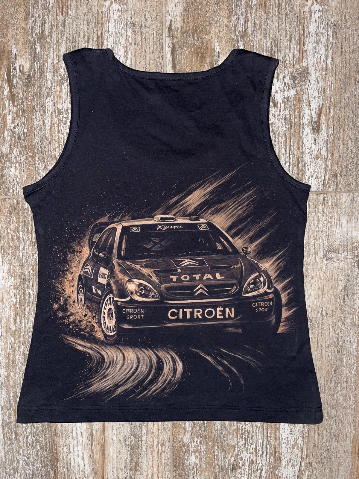 Bleach shirt design featuring a hand-painted rally car on a black T-shirt with detailed bleach art