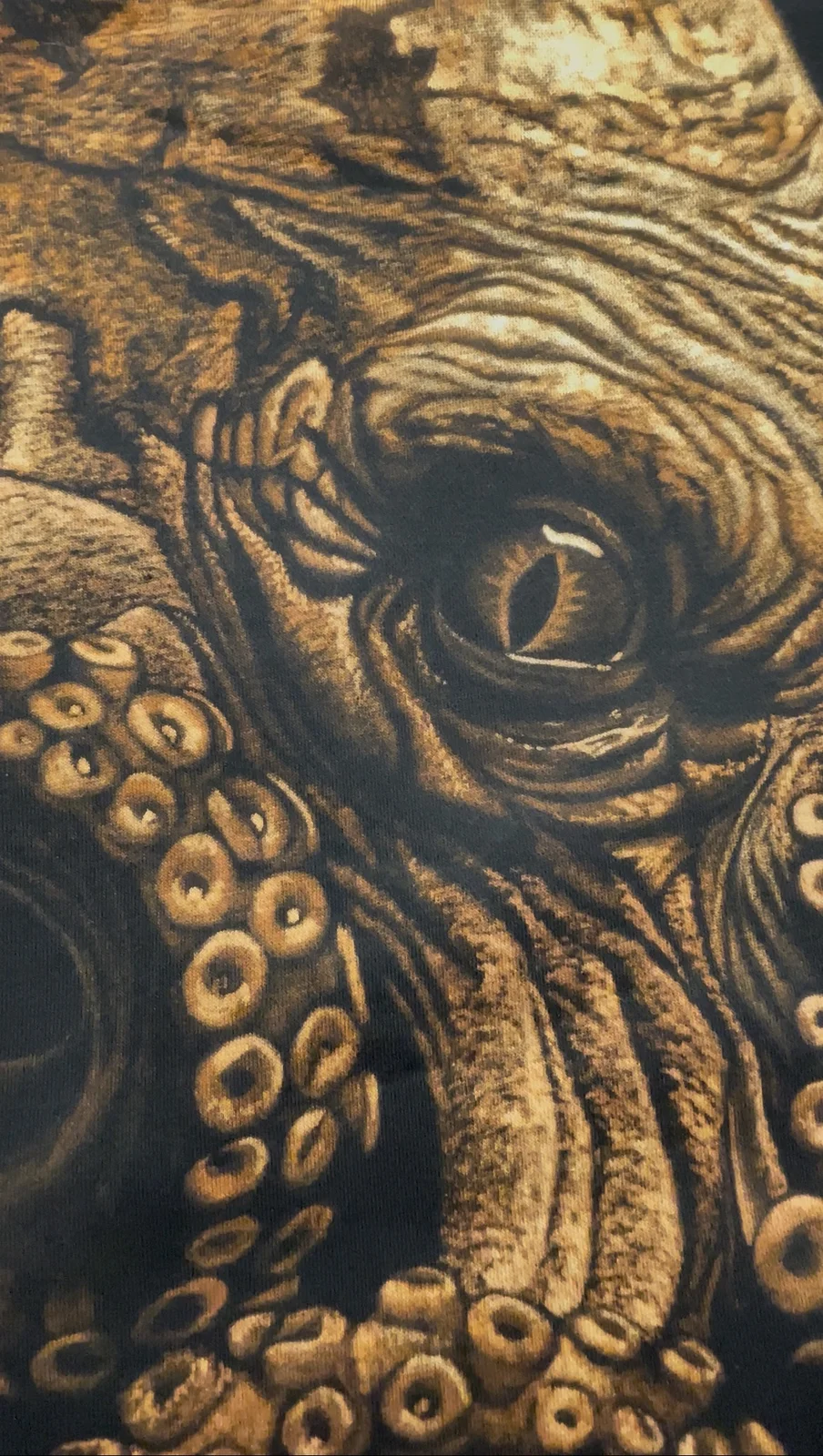 Close-up of bleach art details on black shirt