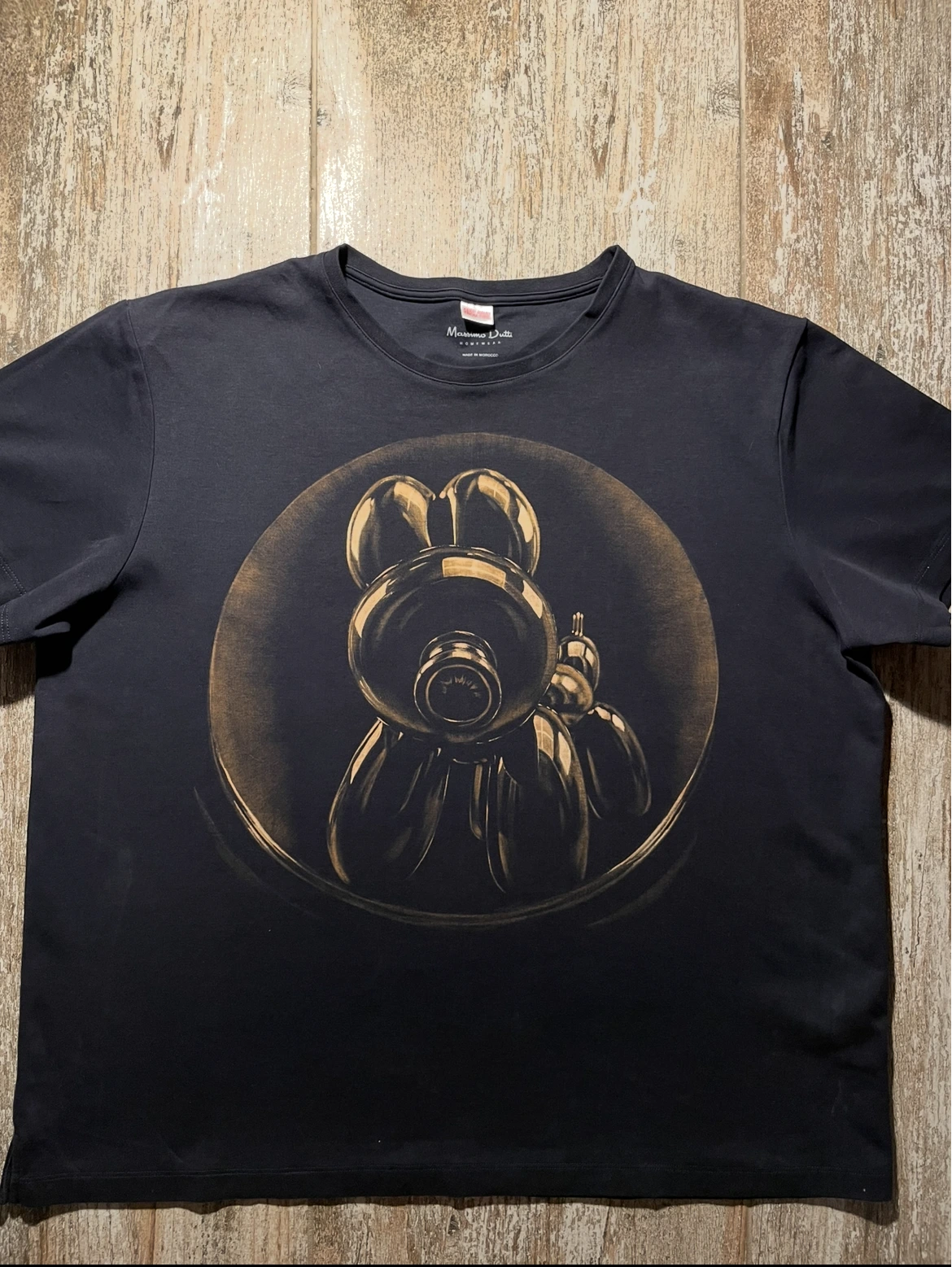 Front view of a two-sided bleach art T-shirt with a small detailed design
