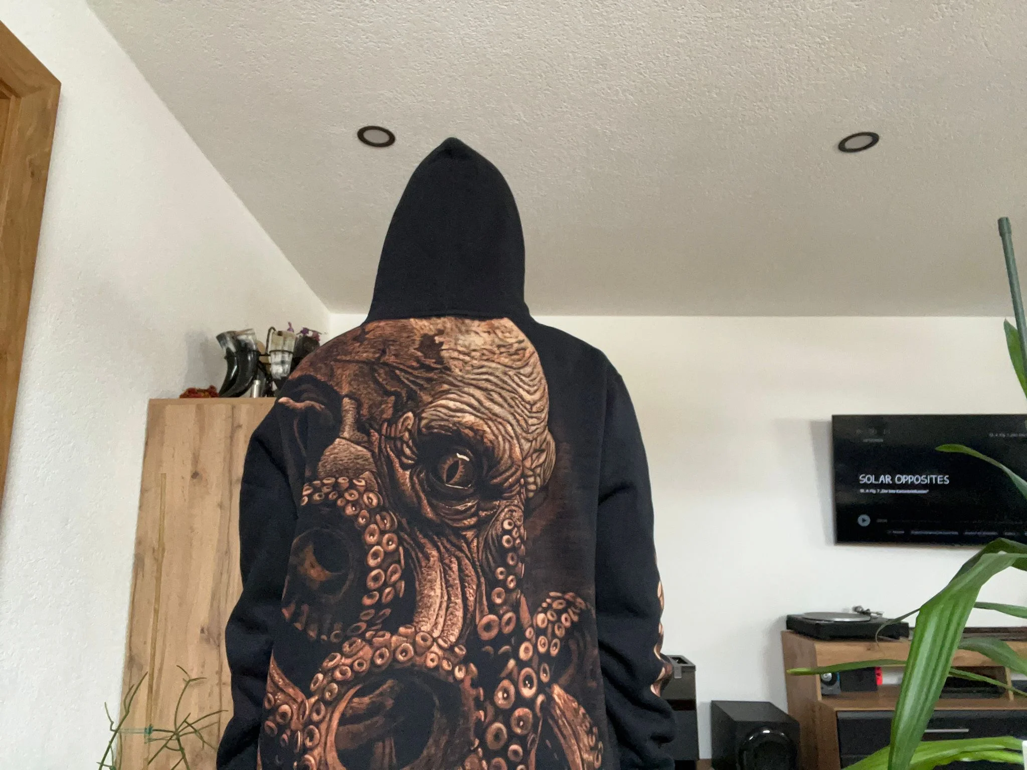 Person wearing handmade bleach art hoodie outdoors