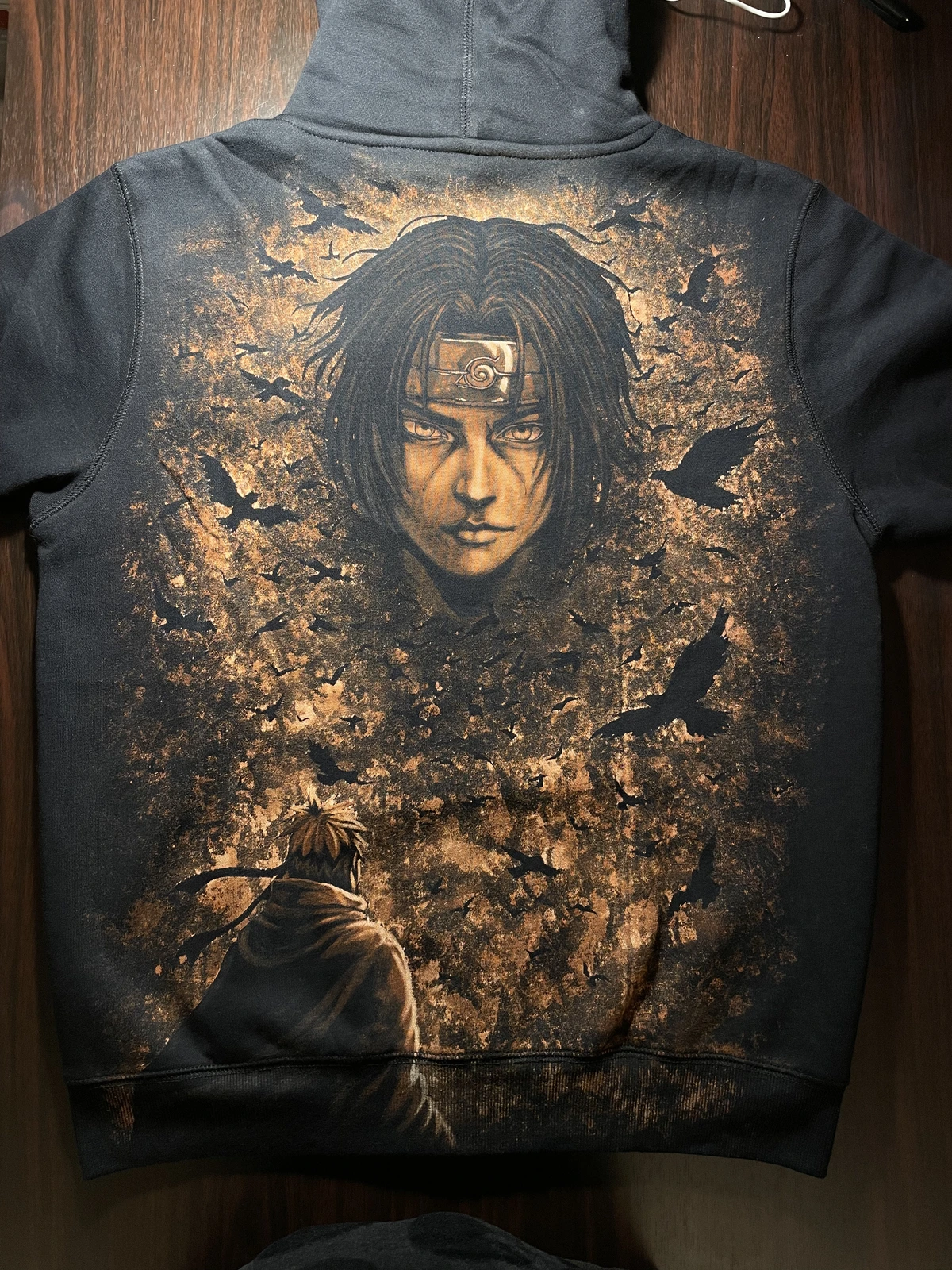 Itachi inspired bleach art zip hoodie with anime scene artwork