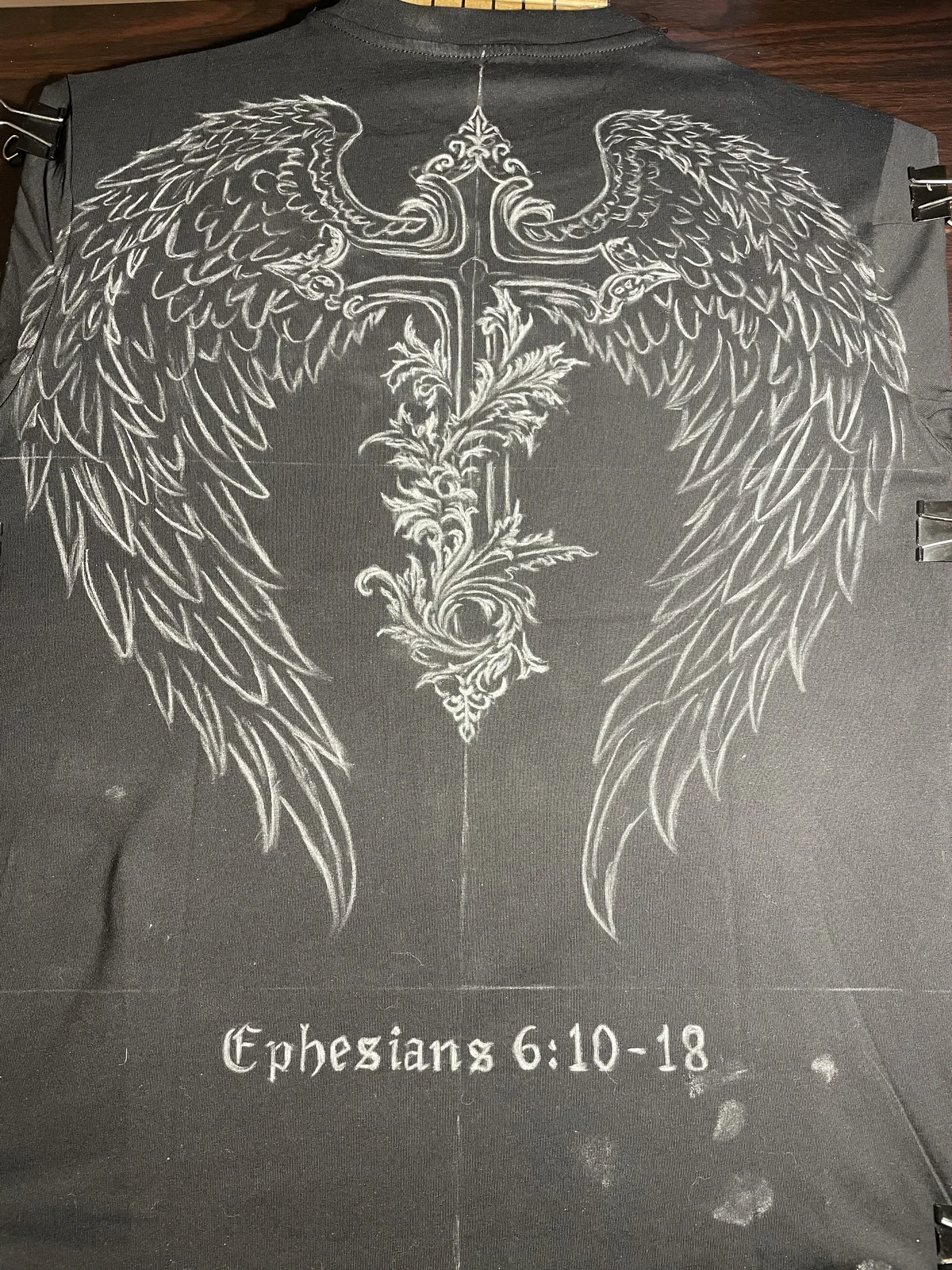 Chalk sketch of custom bleach art design on t-shirt back