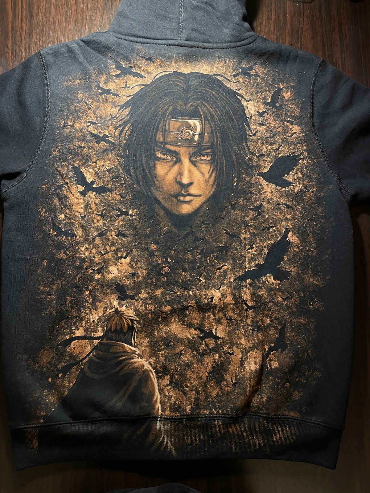 Custom bleach hoodie with hand-painted Itachi anime artwork on black zip hoodie