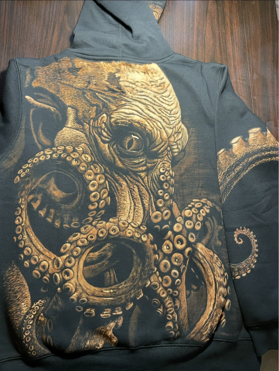 Custom hoodie with hand-painted Kraken bleach art on black hoodie by Helen Oben Art