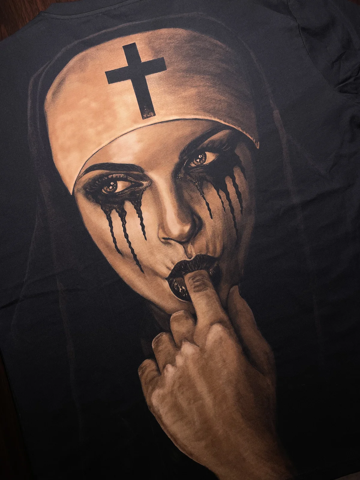 Close-up of professional bleach art on black t-shirt