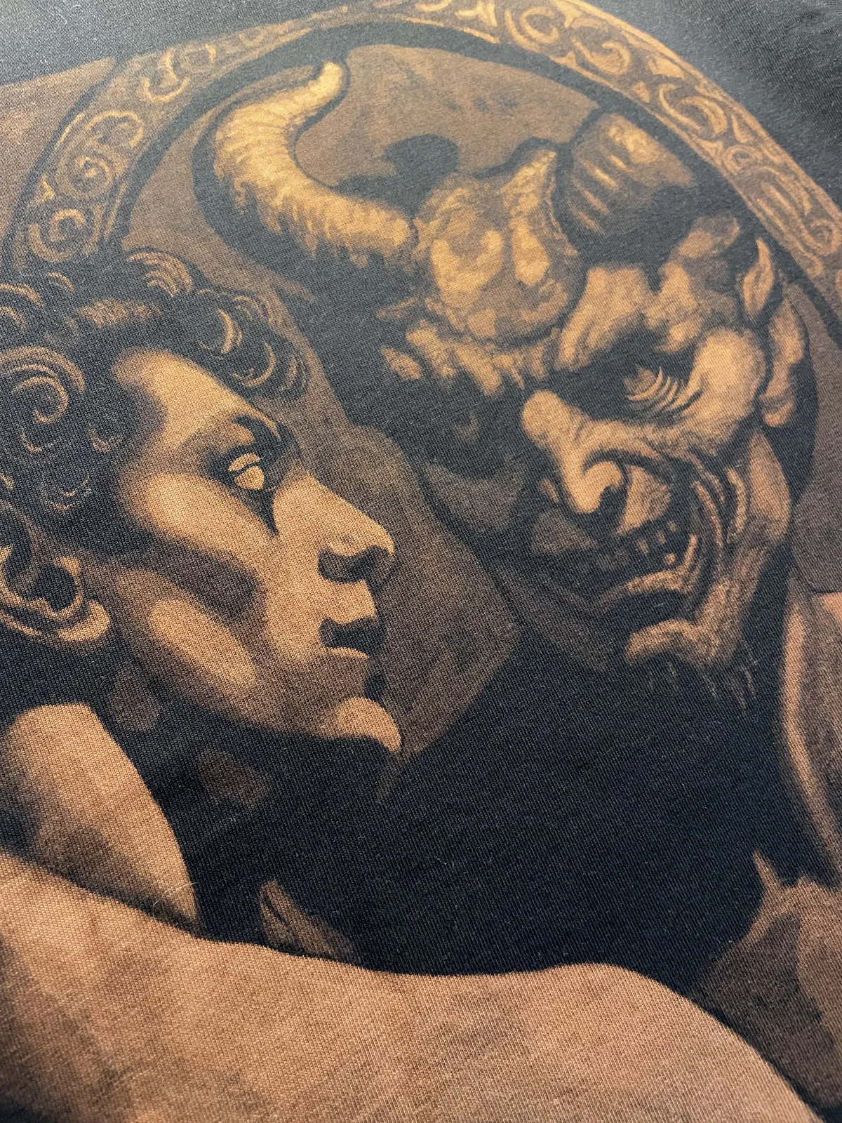 Close-up details of fantasy bleach art design on black fabric