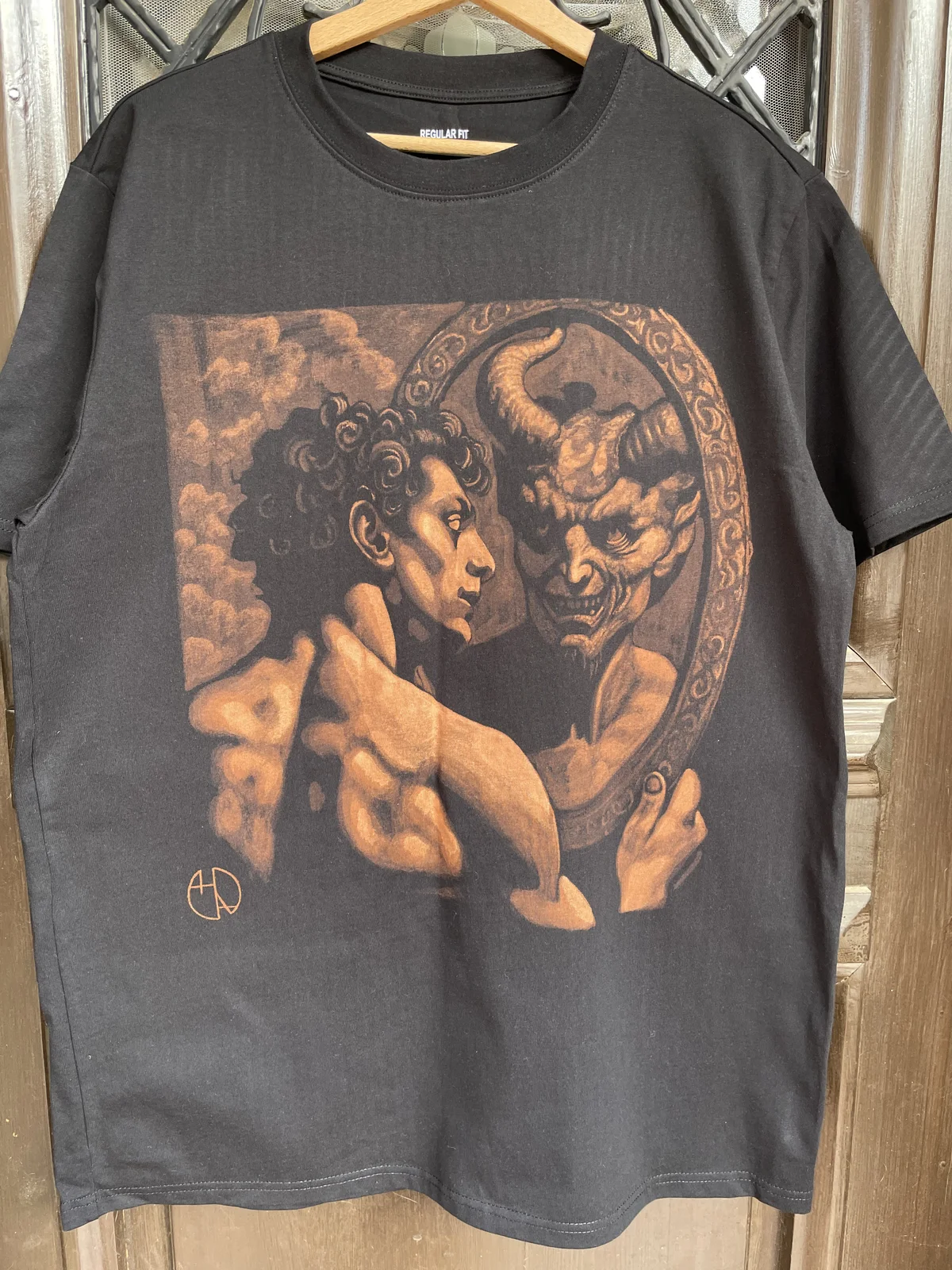 Person wearing fantasy bleach art design on black clothing