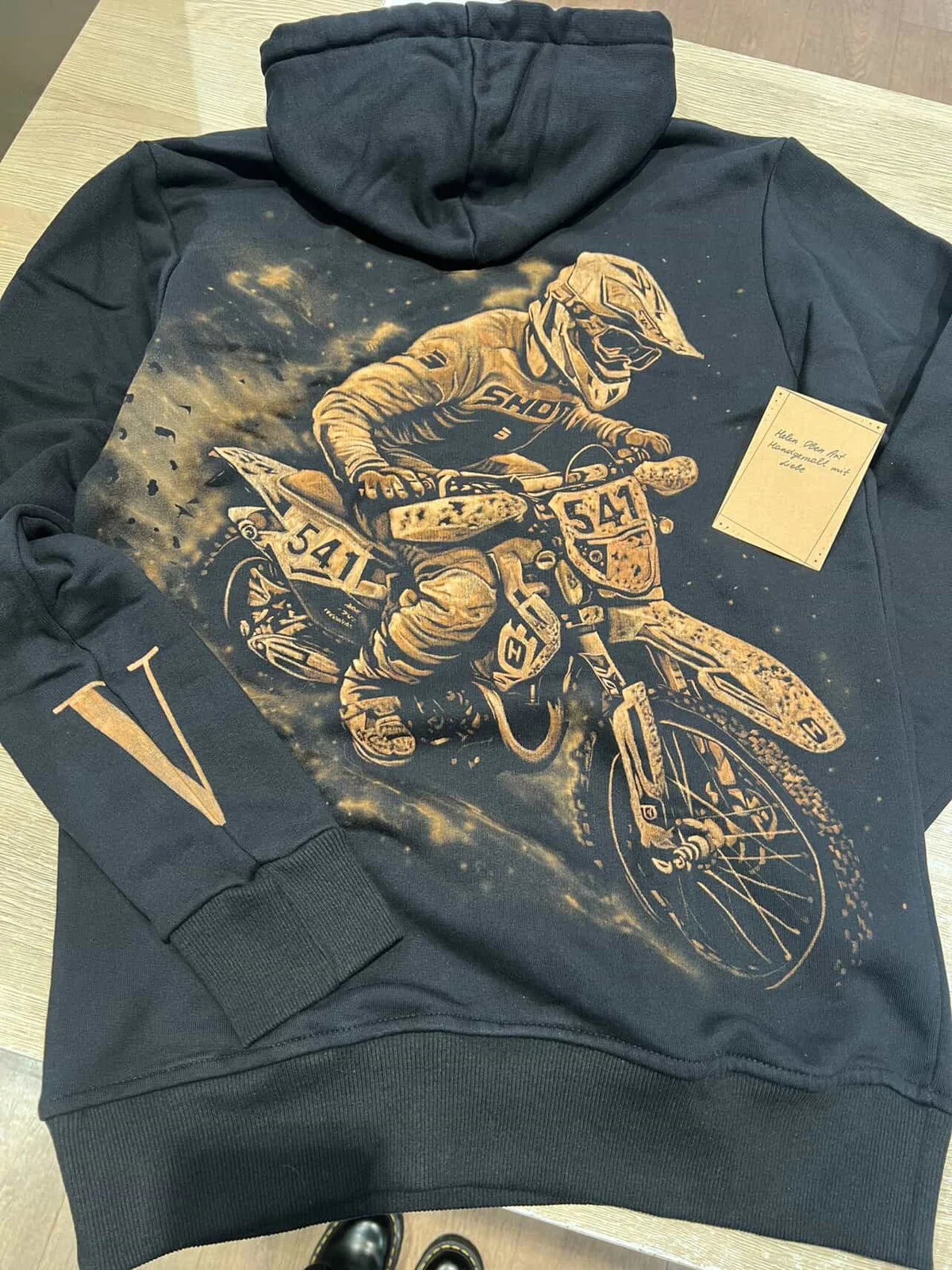 Custom handmade bleach art hoodie prepared for a customer