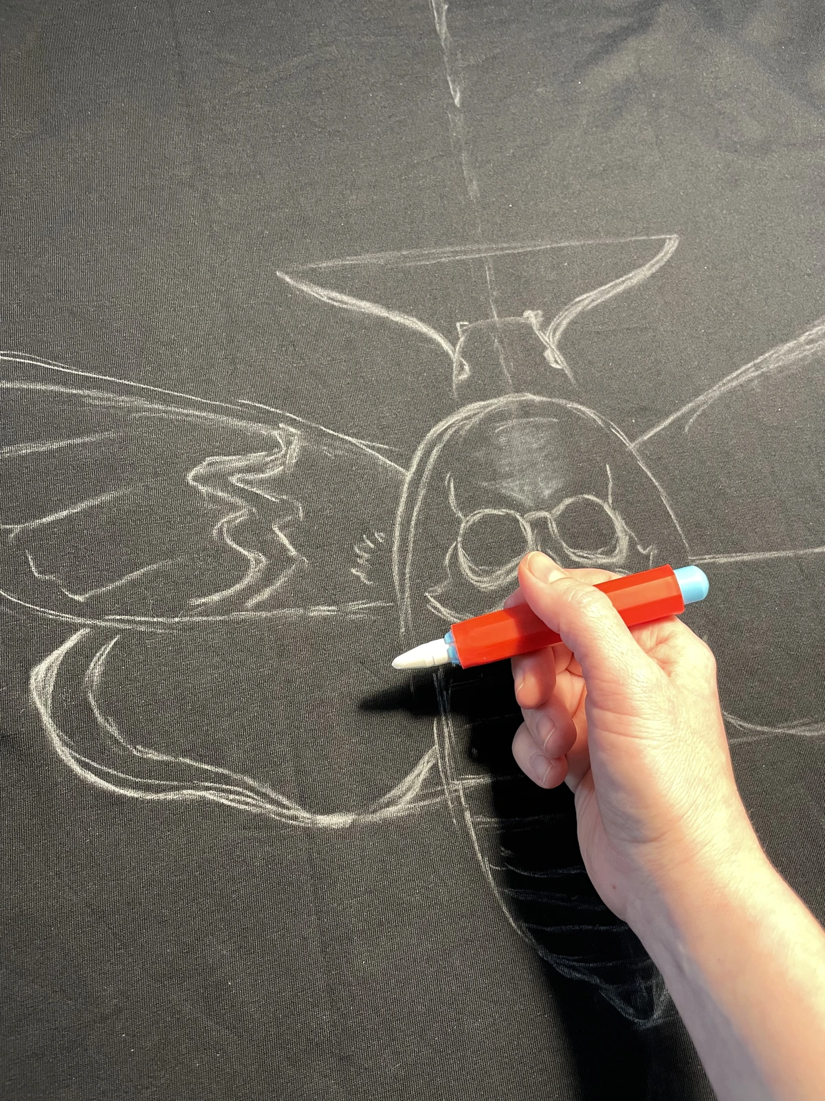 Chalk outline for a bleach design on a black shirt