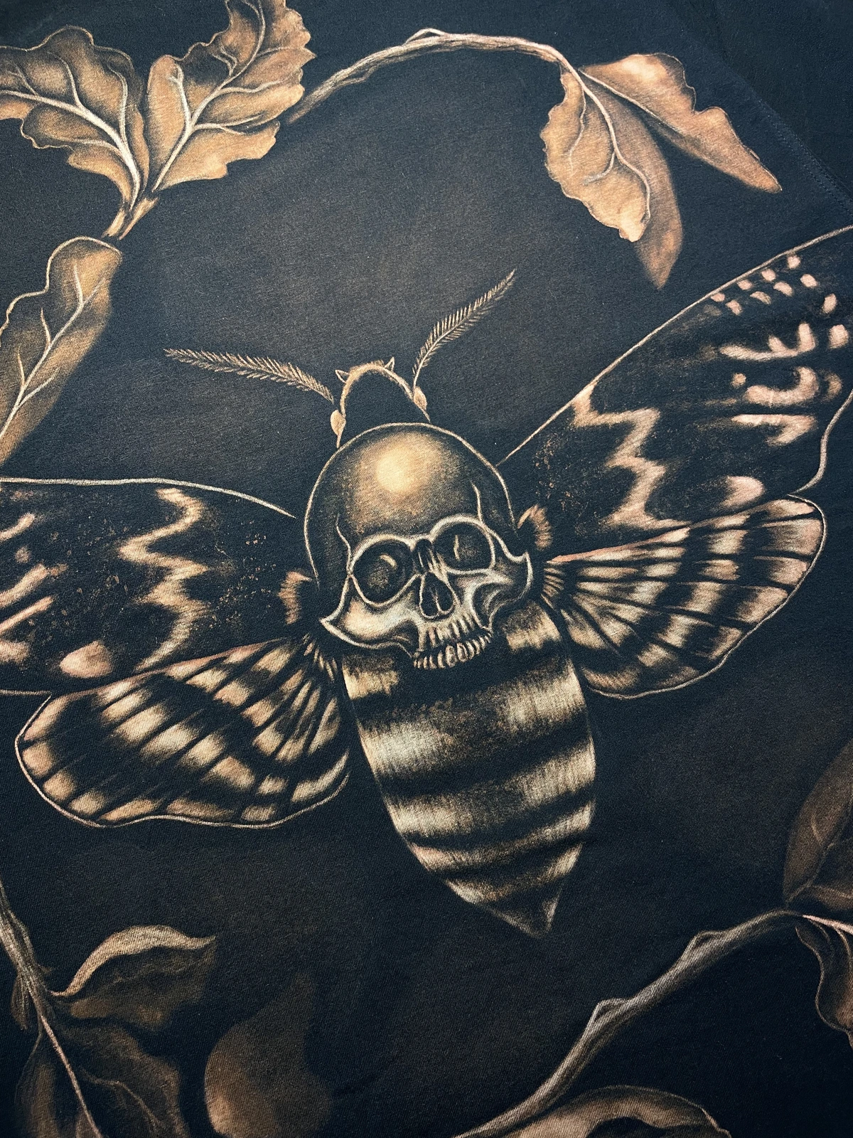Close-up texture of finished bleach art on a shirt
