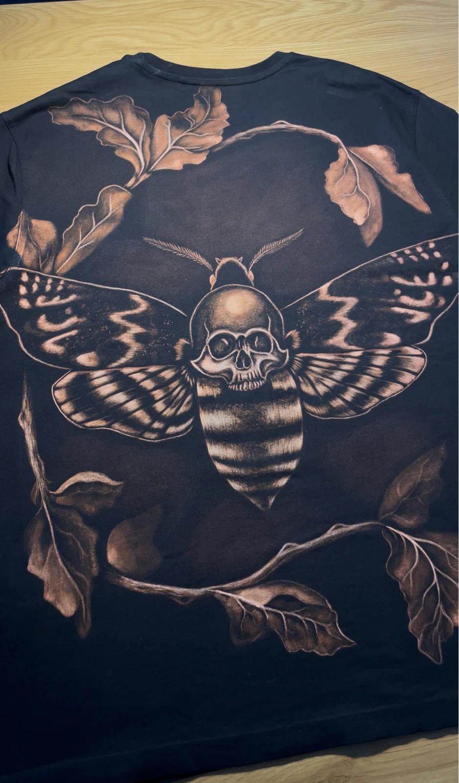 Finished bleach design on a black shirt created by hand