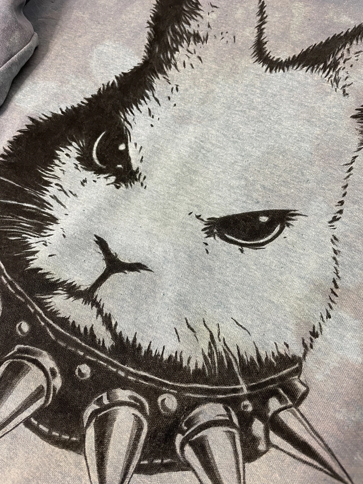 second layer of black paint on rabbit design sweatshirt