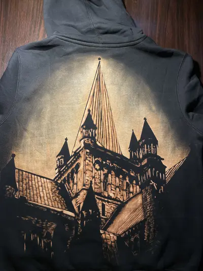 Finished handmade bleach art shirt on black fabric