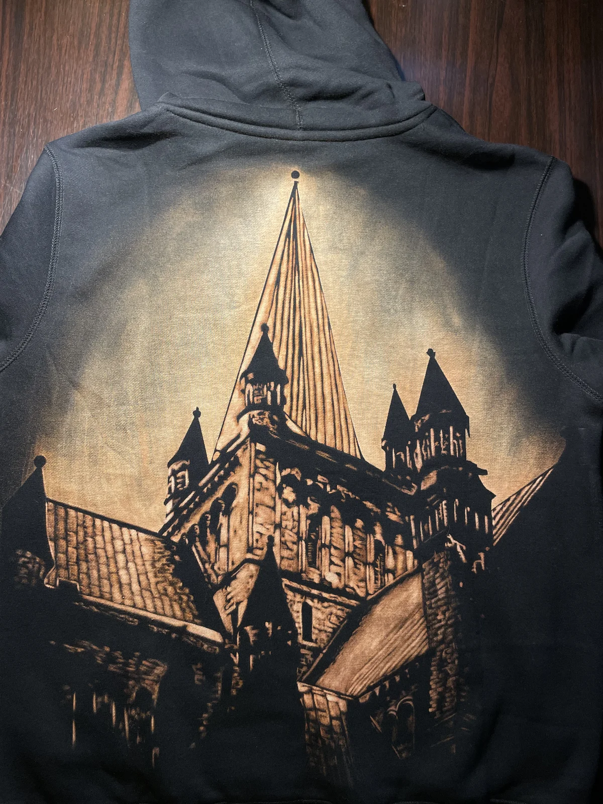 Finished handmade bleach art shirt on black fabric