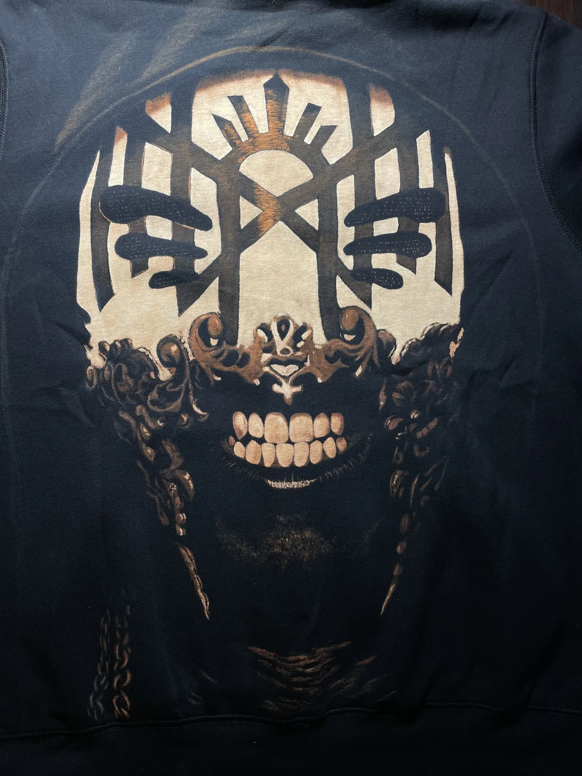 Close-up of pop culture bleach art design on black fabric