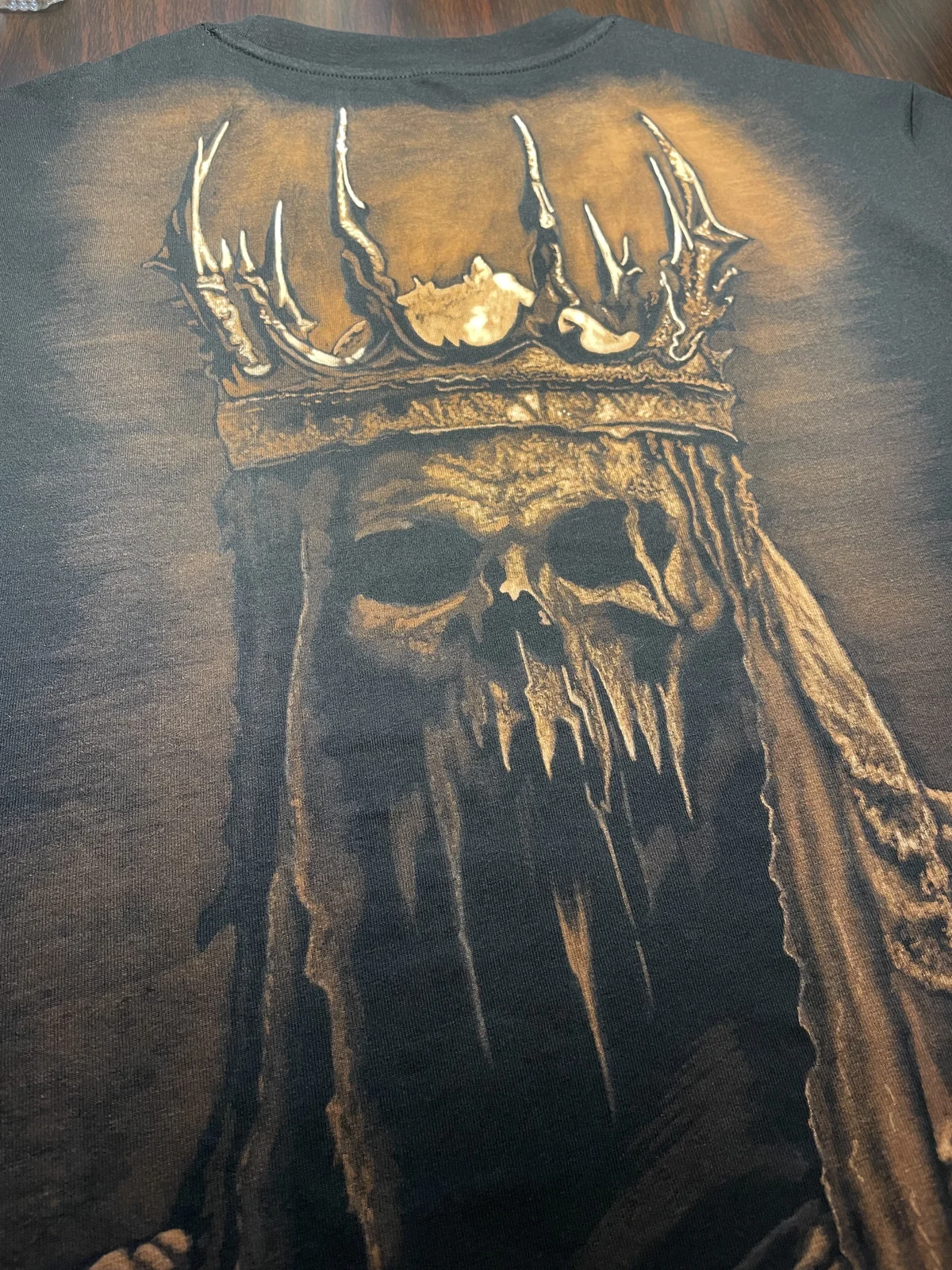 Close-up of skull bleach art design on cotton fabric