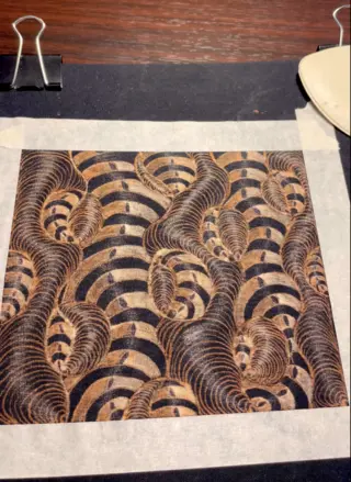 Abstract 3D-style bleach art illustration on black fabric