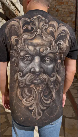 Ancient god face bleach art illustration on a black t-shirt