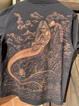 Dark mermaid bleach art illustration on a black t-shirt