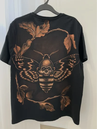 Death's-head moth bleach shirt artwork featuring the famous skull moth design. A dark piece combining gothic bleach shirt designs and alternative bleach clothing designs.