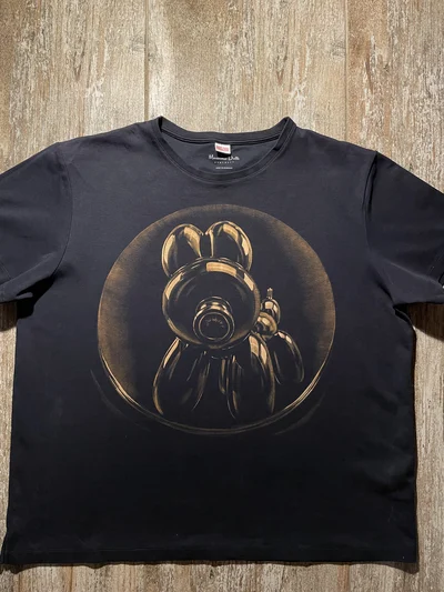 Hand-painted balloon dog artwork created with bleach on premium black cotton.