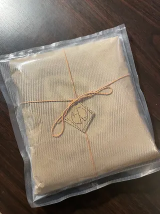 Packaged handmade bleach art t-shirt ready for shipping to a customer