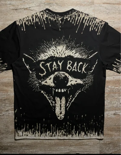 Wild raccoon bleach art t-shirt back design with Stay Back text, grunge animal graphic shirt