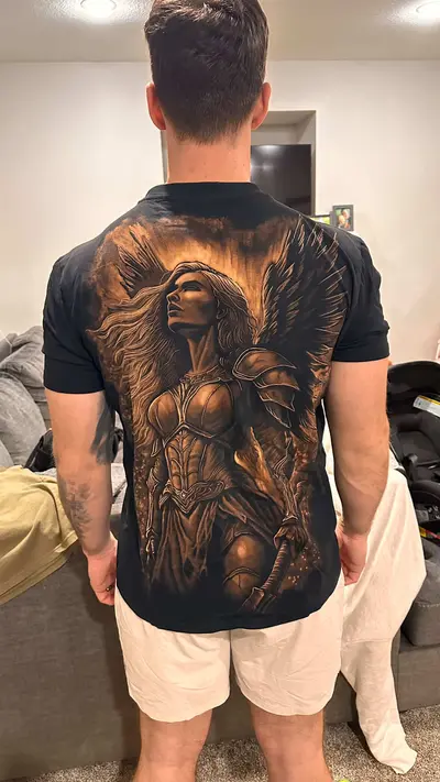 Customer photo showing how a hand-painted t-shirt with a Valkyrie design looks when worn