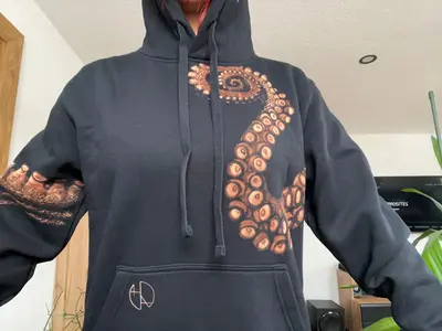 Customer photo showing the front of a hand-painted hoodie with a kraken octopus design
