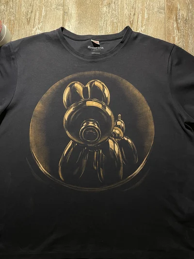 Close-up front view of a handmade Balloon Dog Bleach Art T-Shirt with a detailed balloon dog illustration painted with bleach