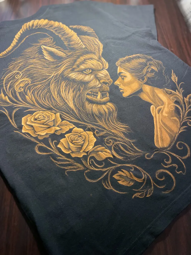 Fairy tale–inspired illustration of a woman and a beast in bleach art style on the back of a t-shirt