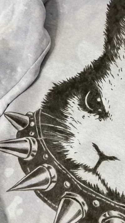 Video of finished angry bunny textile paint artwork on blue sweatshirt