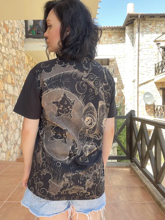 Back view of a celestial moon line art bleach art t-shirt worn by a model