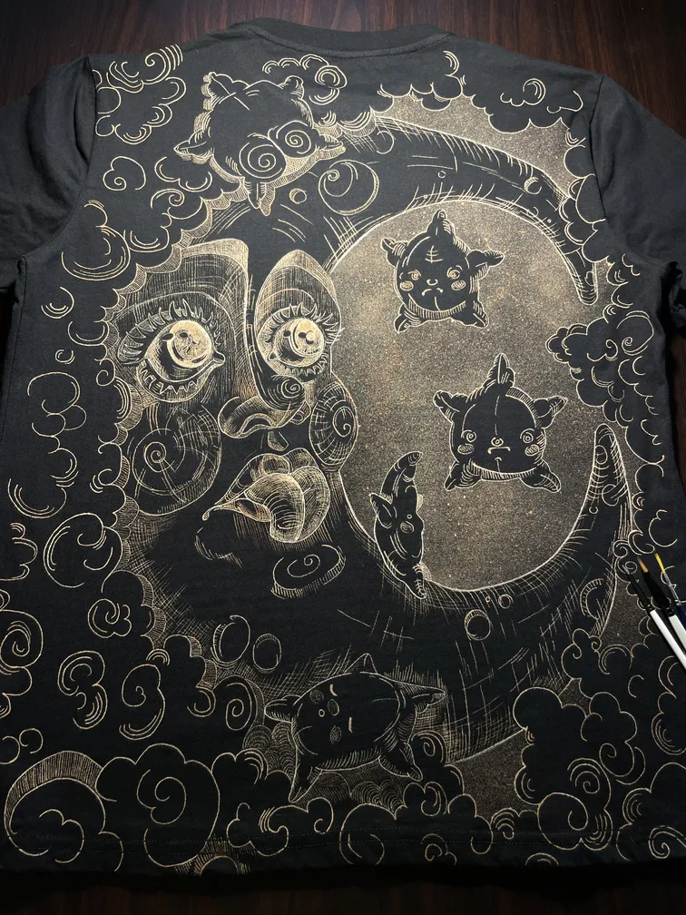 Celestial moon line art bleach art illustration covering the back of a black t-shirt