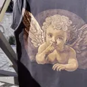 Daylight video showing the cherub bleach art design on the back of the t-shirt