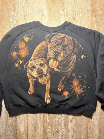 Full back view of a black custom dog portrait sweatshirt with two hand painted bleach art pet portraits
