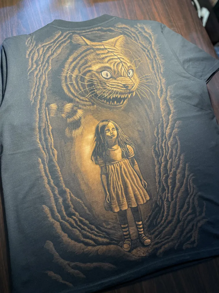 Dark Wonderland–inspired bleach art illustration covering the back of a black t-shirt