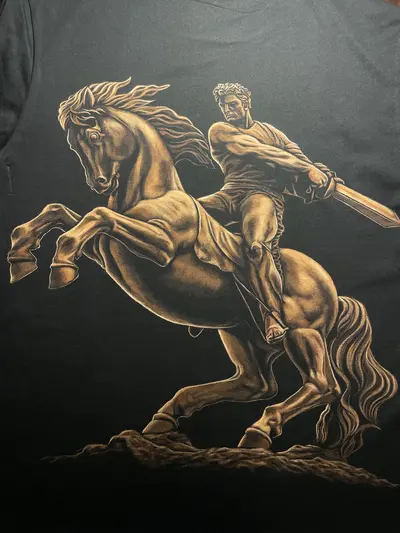 Close-up detail of hand-bleached David of Sassoun artwork on cotton fabric