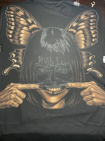Bleach art T-shirt in progress with half finished design of girl face and butterfly wings