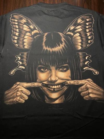 Hand-painted bleach art T-shirt back view with distorted smile girl and butterfly wings full design
